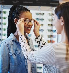 Woman tring on spectacles